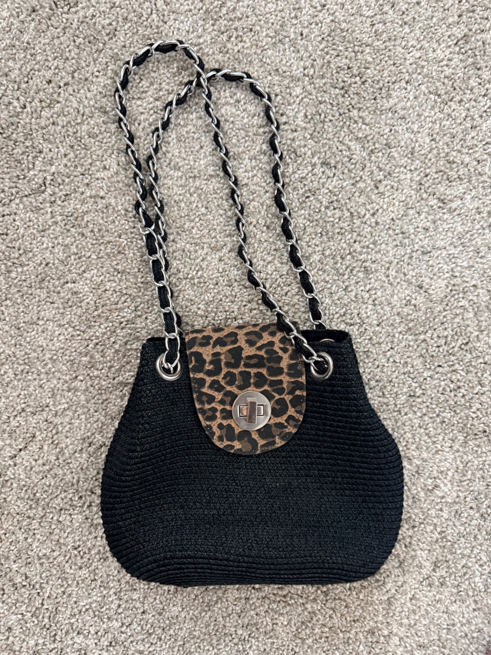 Black woven shoulder bag with chain strap